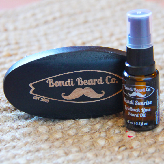 Image of Bondi Beard Co. Laidback Lime Beard Oil and branded boar brush sitting on hessian surface.