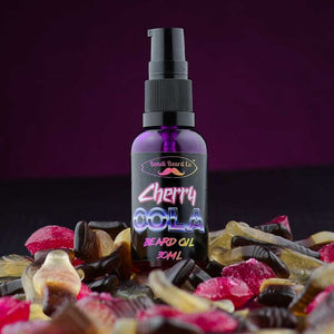 Image of Bondi Beard Co. Cherry Cola Beard Oil spray bottle is surrounded by maraschino cherries and cola bottle confectionery.