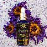 Load image into Gallery viewer, Image of Bondi Beard Co. Osiris Ancient Oil blend on ground with dried blue lotus petals
