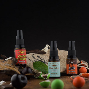 Image of Bondi Beard Co. Chocolate Trio Beard Oil Collection. Three spray bottles with confectionery and hessian bag.